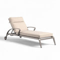Aluminum reclining lounge chair with beige fabric cushion for outdoor use